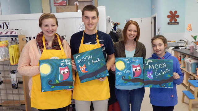 a group of people holding signs