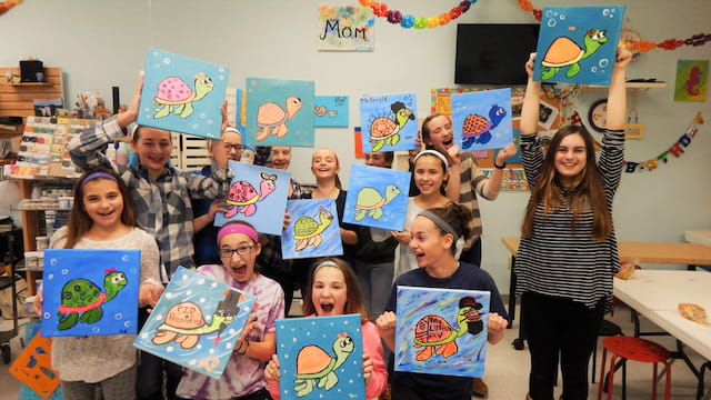 a group of people holding up signs