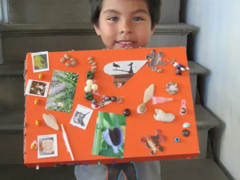 a boy holding a board