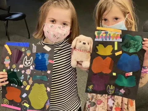 a couple of girls holding books