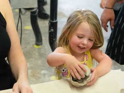 a child holding a turtle