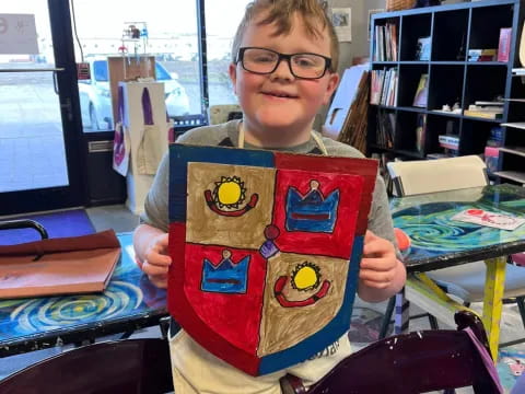 a boy holding a book