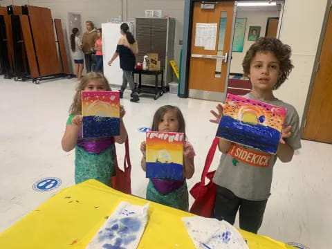 a group of children holding signs
