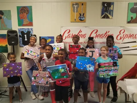 a group of children holding signs