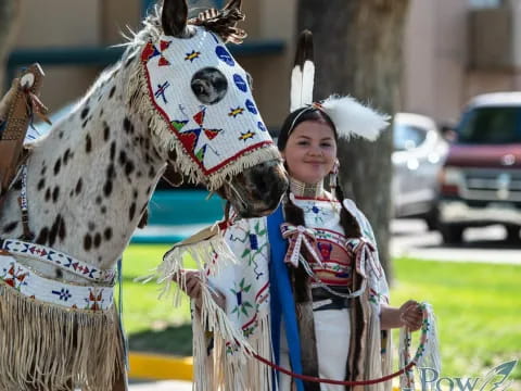 a person standing next to a horse