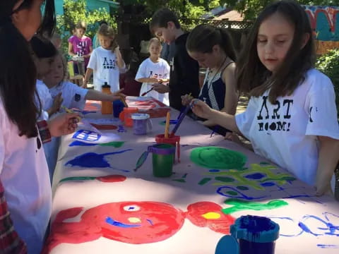 a group of children painting