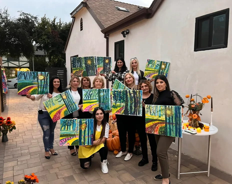 a group of people holding kites