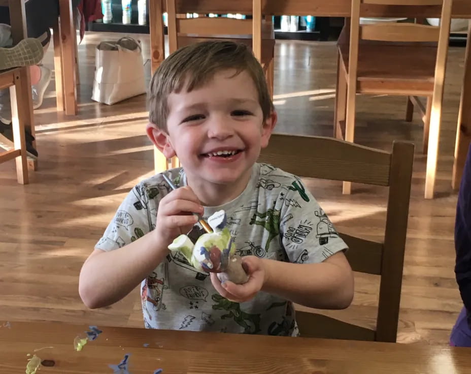 a boy sitting at a table