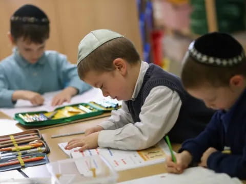 a few young boys studying