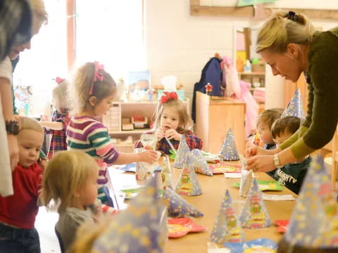 a person and children at a table