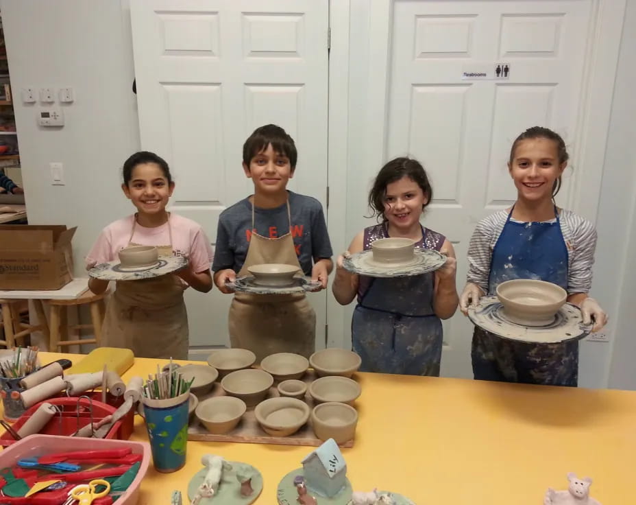 a group of people holding plates