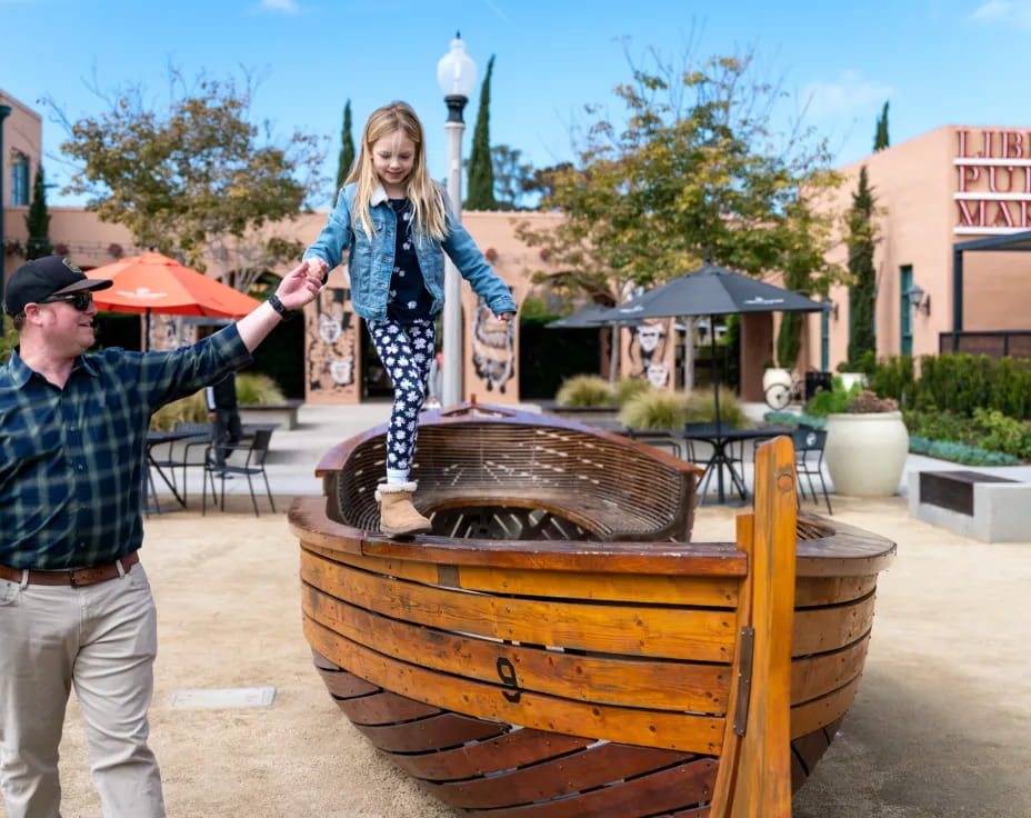 a person standing on a barrel