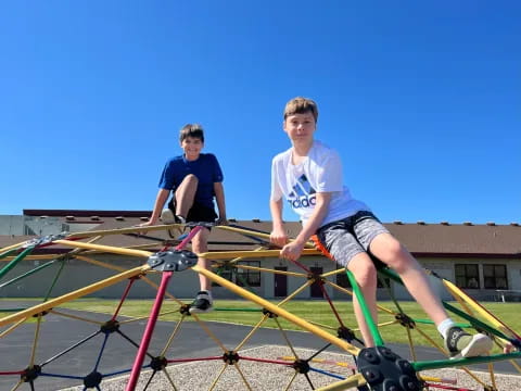 a couple of boys on a playground