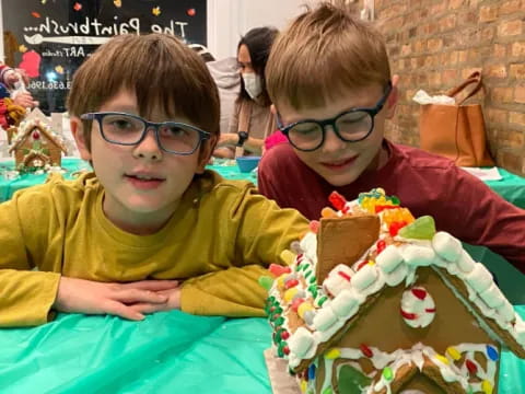 two boys sitting at a table