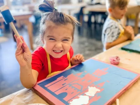 a young girl painting