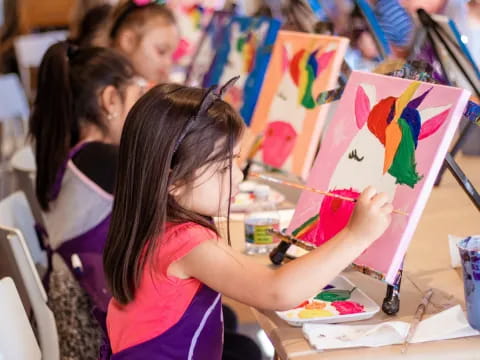 a group of children painting