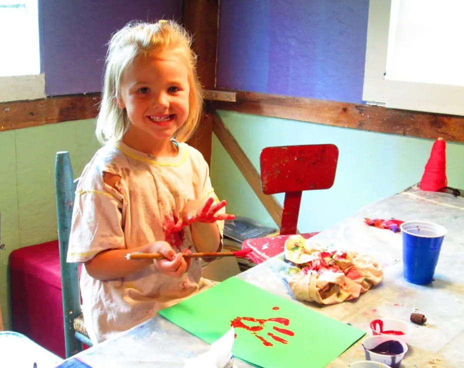 a girl eating a pizza