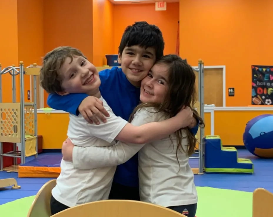 a man and woman holding a child