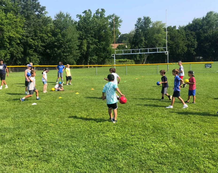 a group of kids playing football
