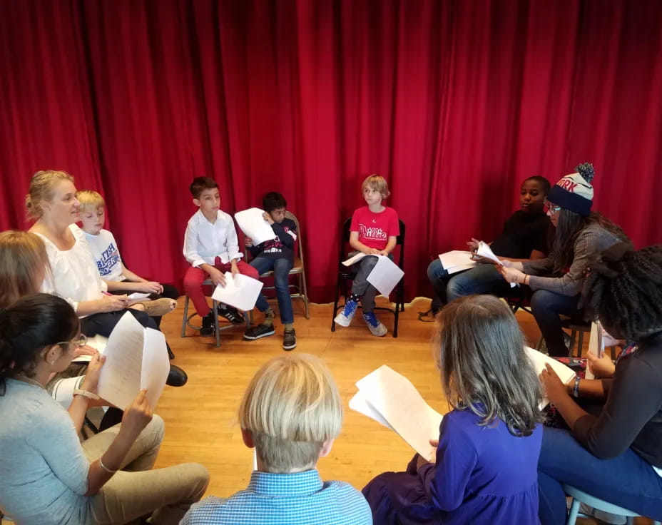 a group of people sitting in chairs