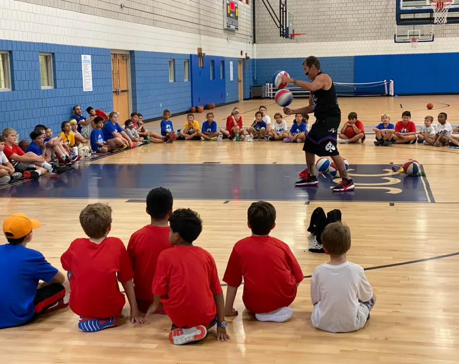 a group of kids playing basketball