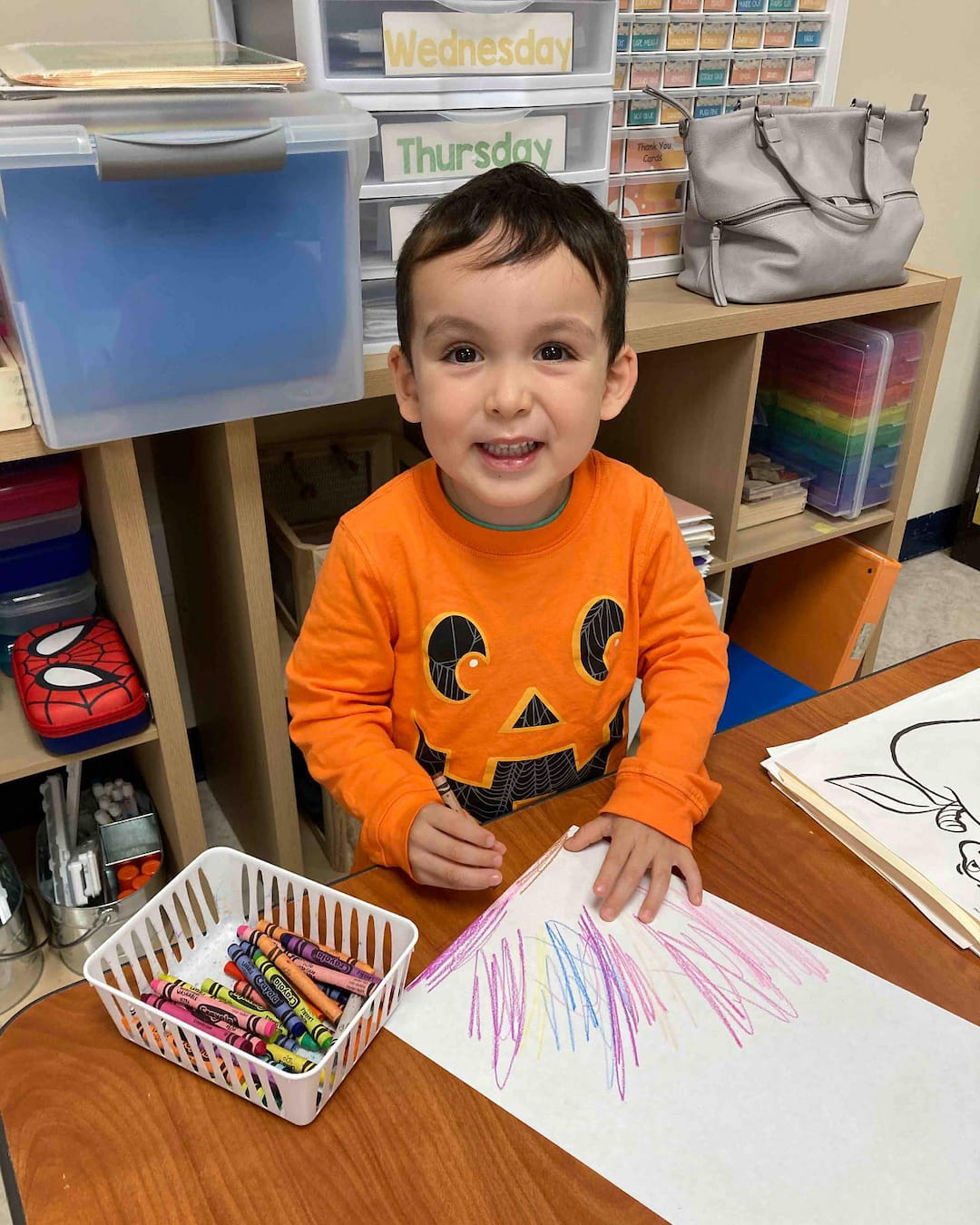 a boy sitting at a table