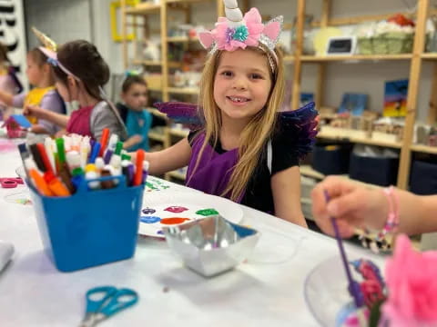 a young girl with a crown