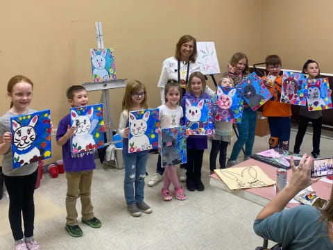 a group of children holding signs