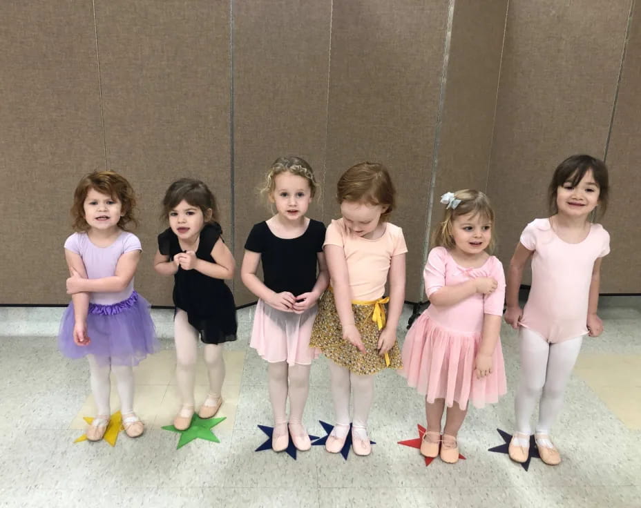 a group of girls posing for a photo