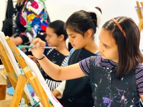 a group of children painting