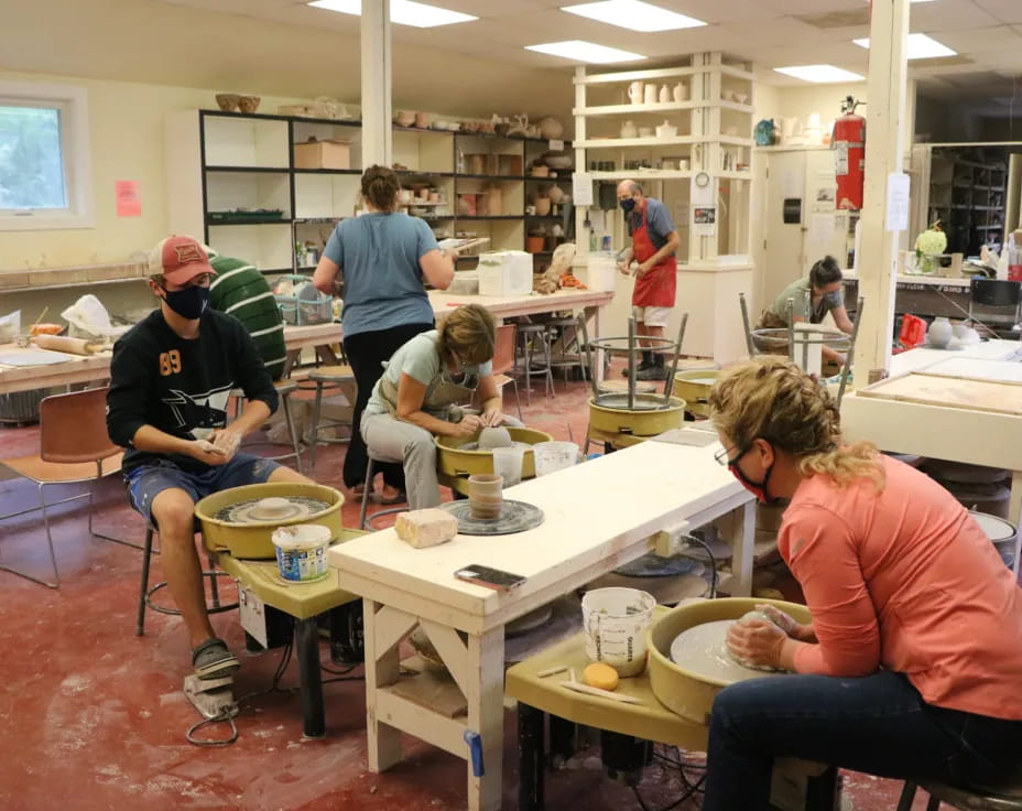 a group of people working in a room