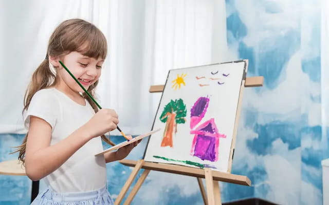 a young girl painting