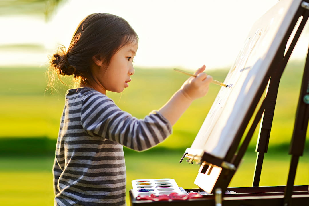 a young girl painting
