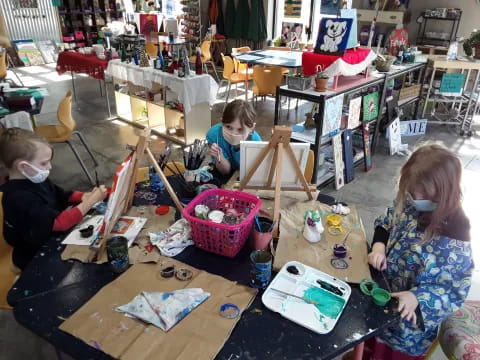 a group of children painting