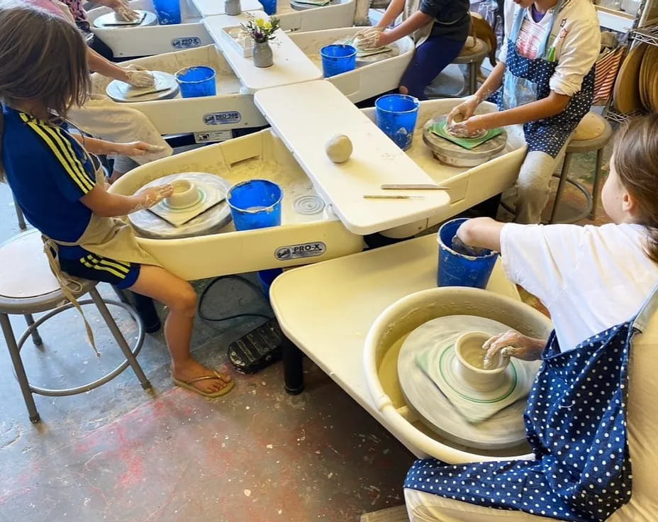 a group of children painting