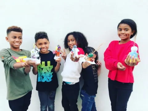 a group of people holding toys