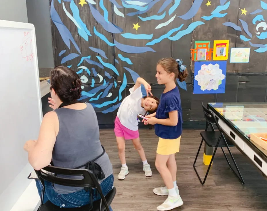 a person and a child painting