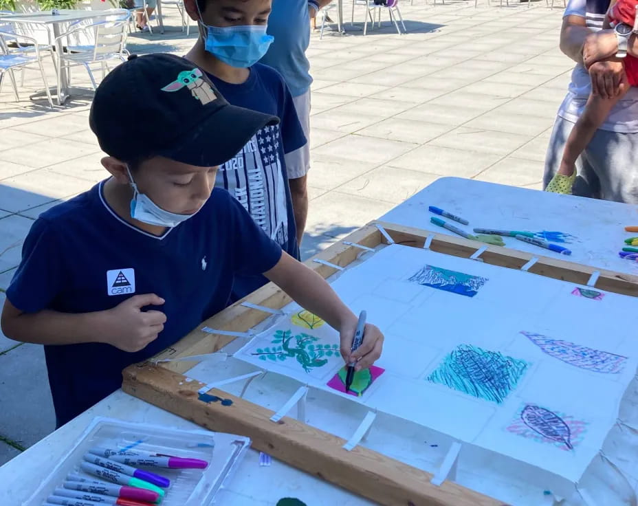 a few young boys painting
