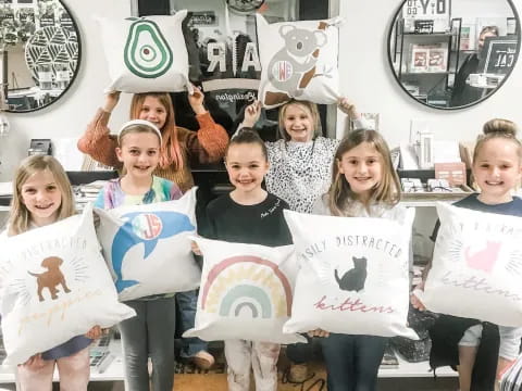 a group of children holding signs