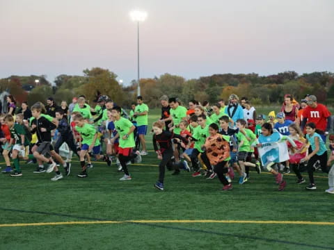 a group of people running on a field