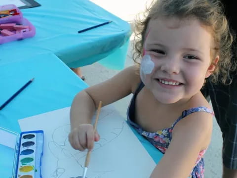 a young girl painting
