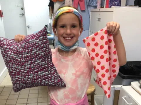 a girl holding a piece of paper