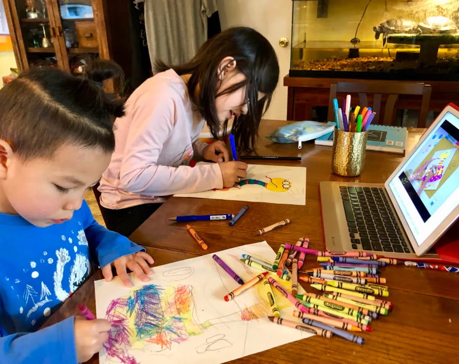 a person and a child painting