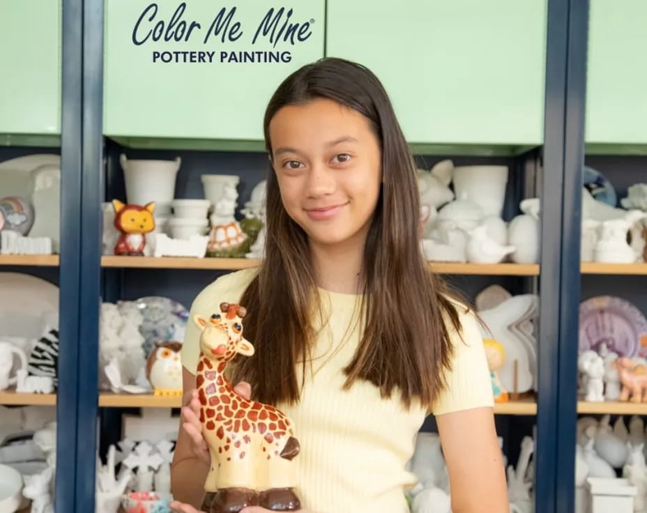 a woman holding a toy