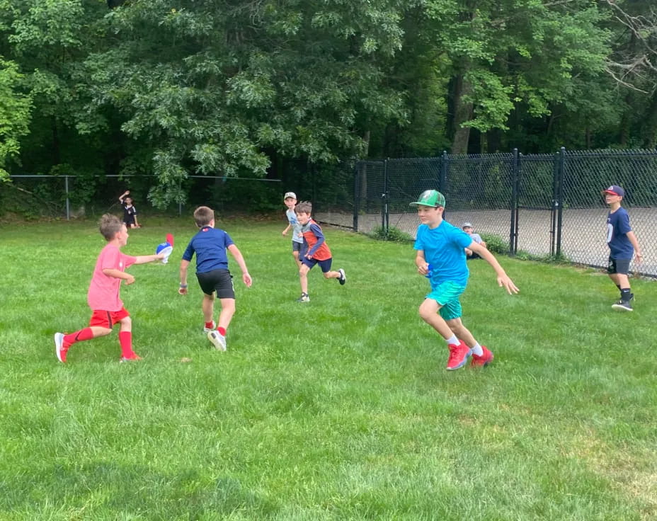 a group of kids playing football