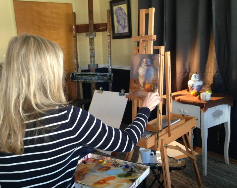 a person painting in a room