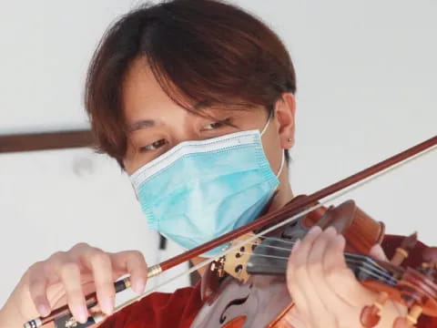 a person playing a violin