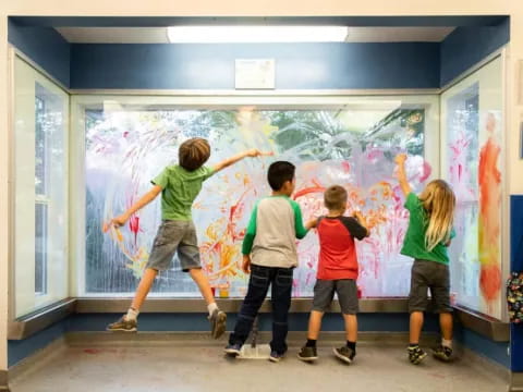 a group of kids painting