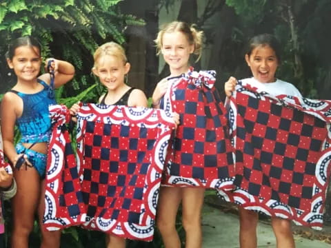 a group of girls wearing clothing