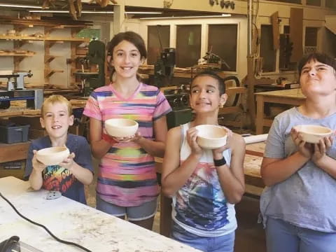 a group of people holding cups